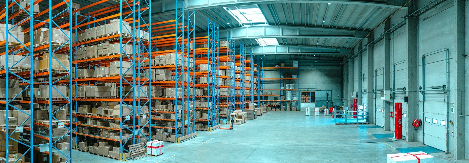 Warehouse storage racking holding boxed inventory, representative of a consignment storage facility